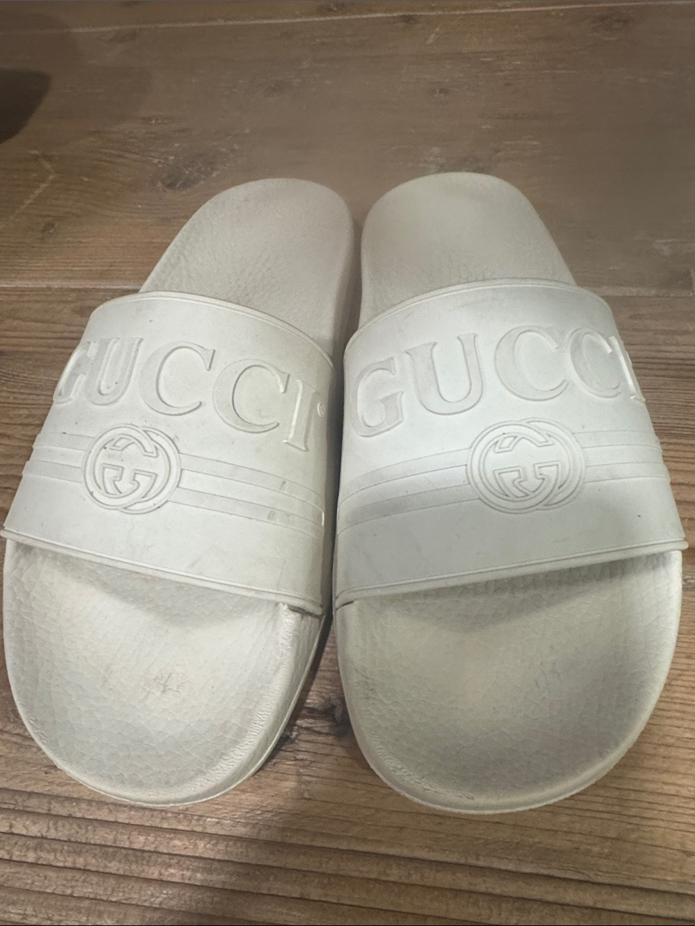 Authentic Gucci Off-White Embossed Logo Slide Sandals